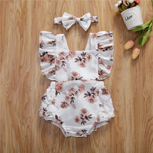 Baby girl sunsuit worn by a baby girl