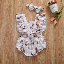Baby girl sunsuit worn by a baby girl