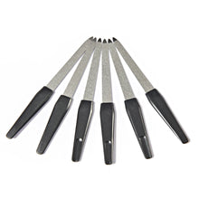 Metal nail files in use shaping natural nails for a clean finish.