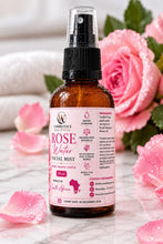 W Cosmetics rose facial mist 50ml amber spray bottle with a pink floral label beside pink roses