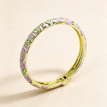 Flower enamel bracelet worn on wrist showing vibrant colour finish.