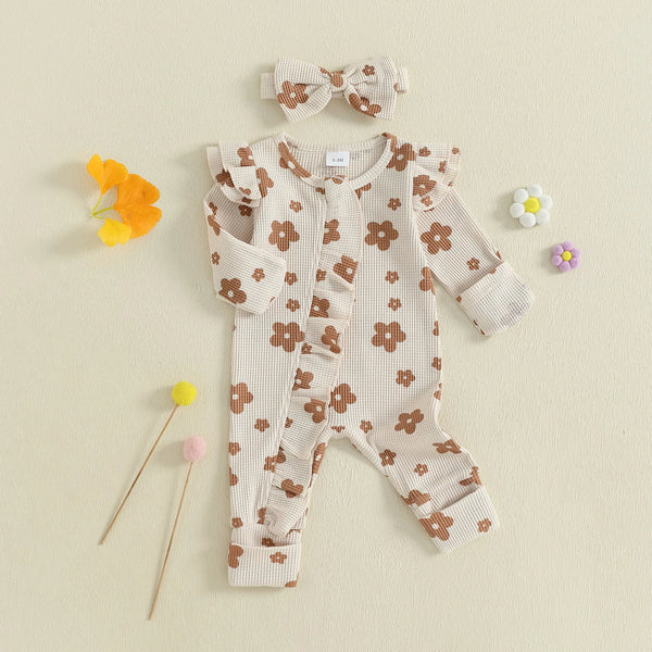 Baby girl floral jumpsuit worn by a baby girl