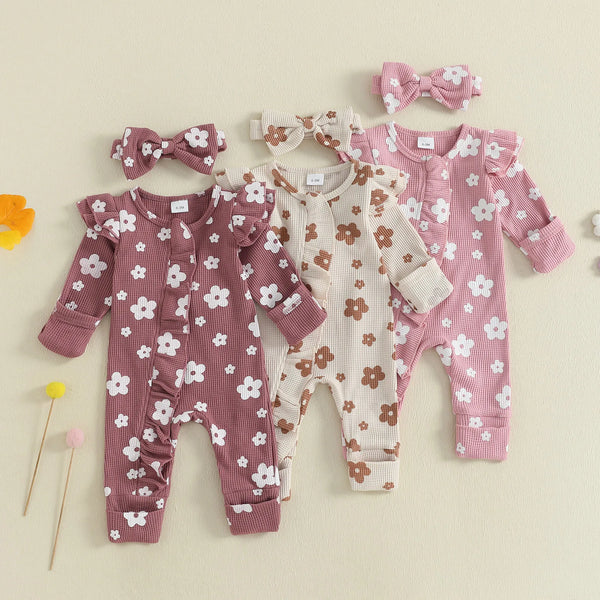 Baby girl floral jumpsuit worn by a baby girl