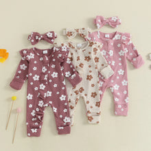 Baby girl floral jumpsuit worn by a baby girl