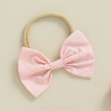 Baby girl romper dress worn by a baby girl