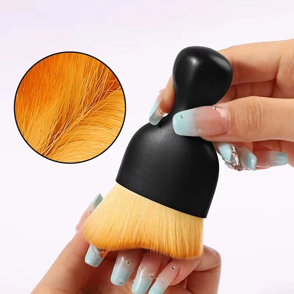 Nail art dust brush for removing acrylic dust from nails.