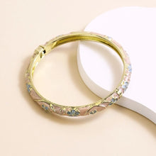 Flower enamel bracelet worn on wrist showing vibrant colour finish.