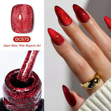 Red glittery nail polish with a bottle and nails on a white background