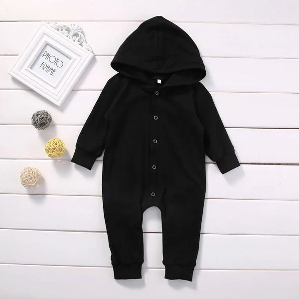 Black baby romper worn by a baby boy