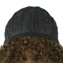 Curly pixie cut human hair wig available at Her Wardrobe & Beyond.