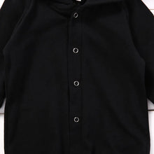 Black baby romper worn by a baby boy