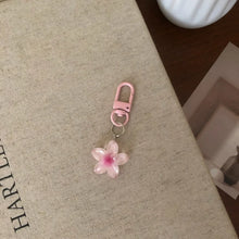 Flower keychain resin pendant available at Her Wardrobe & Beyond.