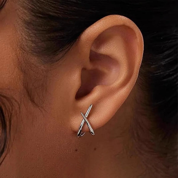 Gold cross stud earrings gold-tone finish close-up detail shot.