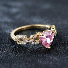 Pink diamond heart ring close-up with polished finish