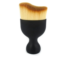 Nail art dust brush for removing acrylic dust from nails.