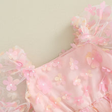 Baby girl romper dress worn by a baby girl