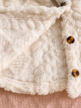 Baby girl hooded cape with button closure and wide hem