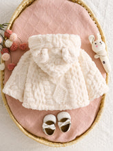 Baby girl hooded cape with button closure and wide hem