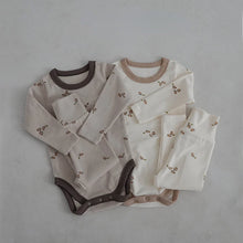  Baby romper and pants set worn by a baby