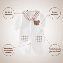  Newborn baby romper shown flat with button closures
