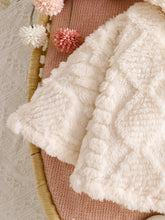 Baby girl hooded cape with button closure and wide hem