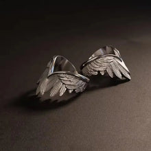 Angel wings ring adjustable open band fits most finger sizes.