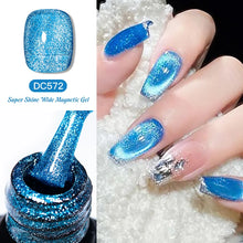 Blue glittery nail polish with a bottle and nails on a white background