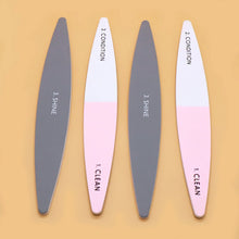 Nail buffer file in use sanding and smoothing natural nails.
