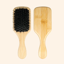 Hairbrush with Wooden' Handle.