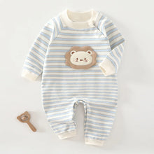Cotton baby onesie worn by a baby