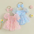 Baby girl romper dress worn by a baby girl