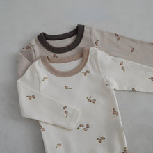  Baby romper and pants set worn by a baby