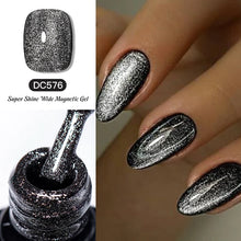 Silver glitter nail polish with a bottle and application on nails, labeled DC576.