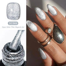 Silver glitter nail polish with a bottle and application on nails.