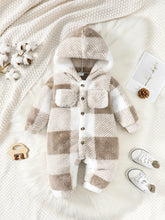  Hooded baby jumpsuit worn by a baby