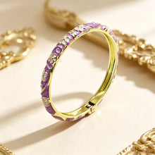 Flower enamel bracelet worn on wrist showing vibrant colour finish.
