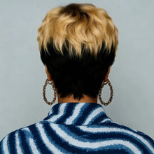 Pixie cut curly wig with bangs front view showing natural wave texture.