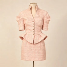 Pink Tweed 2 Piece Outfit Women displayed on a dress form, showcasing its stylish design and elegant details.