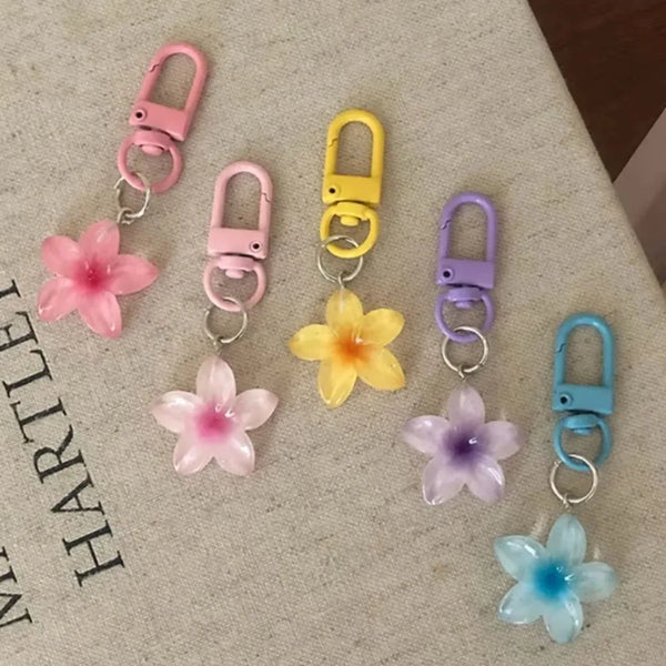 Flower keychain resin pendant colourful sweet designs flat lay.