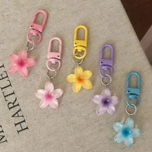 Flower keychain resin pendant colourful sweet designs flat lay.