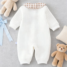 Newborn baby romper shown flat with button closures