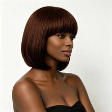 Synthetic wig with bangs front view showing face-framing short cut.