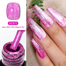 Pink glittery nail polish with a bottle and application on nails.