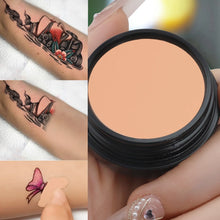 Full coverage concealer waterproof applied over tattoo for coverage.