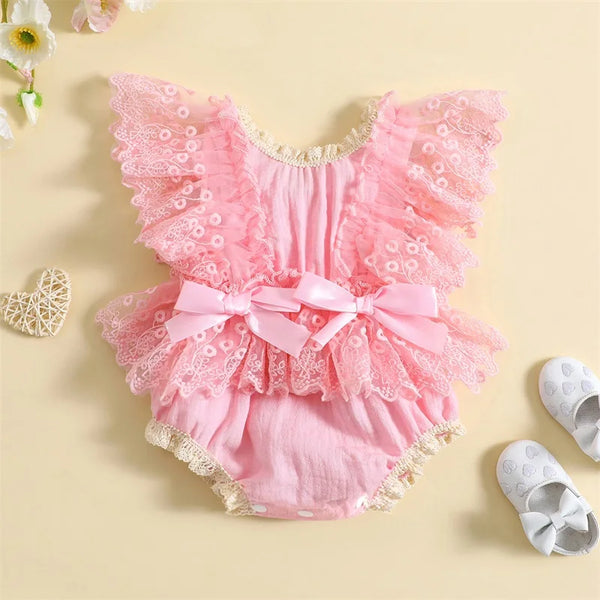 Baby girl lace bodysuit worn by a baby girl