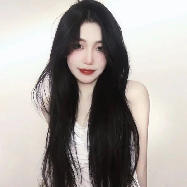 1. Black straight hair wig with middle part fringe — full length view. 2. Black straight hair wig showing smooth tangle-free synthetic fibres. 3. Black straight hair wig with adjustable band for secure fit. 4. Black straight hair wig middle part fringe framing the face. 5. Black straight hair wig worn for casual daily wear look. 6. Black straight hair wig available at Her Wardrobe & Beyond.