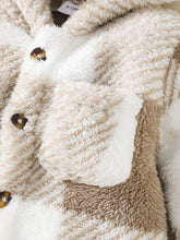  Hooded baby jumpsuit worn by a baby