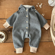 Rainbow baby jumpsuit with an attached winter hood