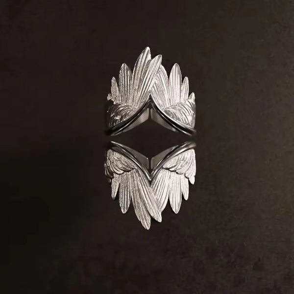 Angel wings ring adjustable showing intricate wing detail close-up.