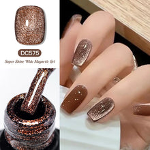 Super Shine Wide Magnetic Gel DC575 with glittery brown nail polish on nails and bottle.